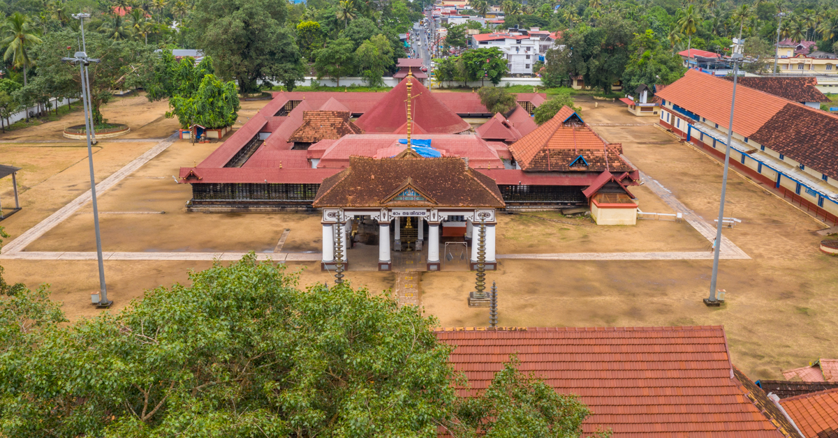 Vaikom Shiva temples view, four cardinal directions structures with sloping red roofs and glistening golden kalashes on top